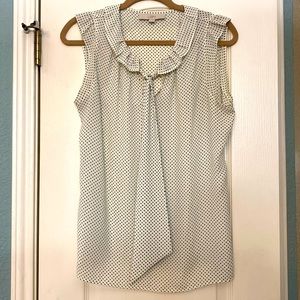 Adorable sleeveless blouse. Creme with black polka dots. Size M